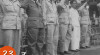 Foto pejabat Militer  sedang memberi hormat dalam upacara penyerahan Markas Besar Militaire Luchvart (ML) kepada TRI Angkatan Udara. 23 Juni 1950